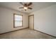 Bedroom featuring a window, ceiling fan, neutral carpet, and closet at 115 W Park Ln, Summerville, SC 29486