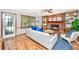 Inviting living room featuring a brick fireplace, built-in shelves, and access to outdoor spaces at 115 W Park Ln, Summerville, SC 29486