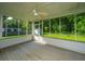 Wide screened-in porch with view of backyard at 115 W Park Ln, Summerville, SC 29486