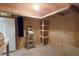 View of the unfinished attic space with ladder and shelving unit at 116 Marshside Dr, Summerville, SC 29485
