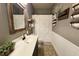 Charming bathroom with single vanity, decorative shelves, and tiled floor at 116 Marshside Dr, Summerville, SC 29485