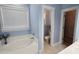 Bathroom with soaking tub and natural light at 116 Marshside Dr, Summerville, SC 29485