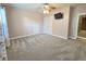Bedroom with carpet flooring, ceiling fan with lights, and attached TV at 116 Marshside Dr, Summerville, SC 29485