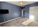 Bedroom features bright window, plush carpet, television, and closet at 116 Marshside Dr, Summerville, SC 29485