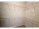 A roomy walk-in closet with wraparound shelving, ready for organization and storage at 116 Marshside Dr, Summerville, SC 29485