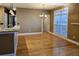Elegant dining area with hardwood floors, natural light, and views of the kitchen, ideal for Gathering gatherings at 116 Marshside Dr, Summerville, SC 29485