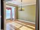 Bright dining room with large bay window, hardwood floors, and chandelier at 116 Marshside Dr, Summerville, SC 29485