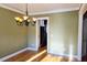 Charming dining room offering hardwood floors and a view into the kitchen at 116 Marshside Dr, Summerville, SC 29485