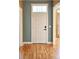 Entryway features hardwood floors, a classic white door with transom window, and views into adjoining rooms at 116 Marshside Dr, Summerville, SC 29485