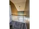 Upstairs hallway with carpet and a white wood banister provides a great aerial view to the bottom floor at 116 Marshside Dr, Summerville, SC 29485