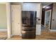 Kitchen featuring stainless steel refrigerator with water dispenser and hardwood floors at 116 Marshside Dr, Summerville, SC 29485