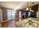 Spacious living room featuring a fireplace, hardwood floors, and plenty of natural light at 116 Marshside Dr, Summerville, SC 29485
