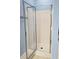 A white tiled shower enclosure provides a clean and modern bathing space at 116 Marshside Dr, Summerville, SC 29485