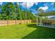 Large fenced backyard with a covered patio and green lawn at 119 Lucca Dr, Summerville, SC 29486