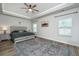 Serene bedroom boasts a tray ceiling, ceiling fan, and neutral décor for a relaxing atmosphere at 119 Lucca Dr, Summerville, SC 29486