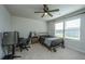 Neutral bedroom with carpet, ceiling fan, a metal bedframe, and large windows providing ample natural light at 119 Lucca Dr, Summerville, SC 29486