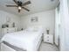 Bright bedroom with a white bed set, neutral walls, and carpet flooring, illuminated by natural light at 119 Lucca Dr, Summerville, SC 29486