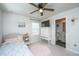 Bright bedroom features a ceiling fan, TV, and adjoining bathroom at 119 Lucca Dr, Summerville, SC 29486
