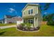 Well-maintained two-story home featuring manicured landscaping and inviting curb appeal on a sunny day at 119 Lucca Dr, Summerville, SC 29486