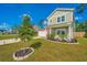 Charming two-story home featuring a landscaped yard, two car garage, and a clear blue sky at 119 Lucca Dr, Summerville, SC 29486