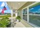 Inviting front porch with stylish columns, a decorative planter, and a clear view of the neighborhood at 119 Lucca Dr, Summerville, SC 29486