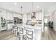 Bright kitchen with stainless steel appliances, island with bar seating, and modern pendant lighting at 119 Lucca Dr, Summerville, SC 29486
