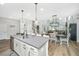 Open-concept kitchen with an island offering a view of the dining and living areas at 119 Lucca Dr, Summerville, SC 29486