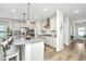 Well-equipped kitchen features an island with barstool seating, modern appliances, and stylish pendant lighting at 119 Lucca Dr, Summerville, SC 29486