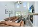 Bright living room with soaring ceilings, a cozy fireplace, and direct access to the outdoor patio at 119 Lucca Dr, Summerville, SC 29486