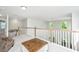 Spacious loft with light walls and carpet, featuring a wood-trimmed railing and an open, airy feel at 119 Lucca Dr, Summerville, SC 29486