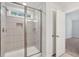 Modern bathroom featuring a glass-enclosed shower and neutral colored tile at 1216 Ashley Hall Rd, Charleston, SC 29407