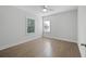 Bright bedroom features natural light with hardwood flooring and neutral walls at 1216 Ashley Hall Rd, Charleston, SC 29407