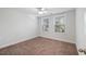 Comfortable bedroom with neutral colored carpet and lots of natural light at 1216 Ashley Hall Rd, Charleston, SC 29407