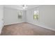 Bright bedroom with neutral carpet and two sunny windows at 1216 Ashley Hall Rd, Charleston, SC 29407