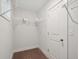 Organized walk-in closet with wire shelving and a neutral colored carpet at 1216 Ashley Hall Rd, Charleston, SC 29407