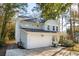 Light blue two-story home featuring a two-car garage and landscaping at 1216 Ashley Hall Rd, Charleston, SC 29407