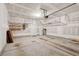 Spacious garage with overhead storage racks and shelving, offering ample room for vehicles and storage at 1216 Ashley Hall Rd, Charleston, SC 29407