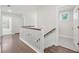 Bright hallway features wooden floors and leads to the bedrooms and bathrooms at 1216 Ashley Hall Rd, Charleston, SC 29407