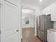 Well-equipped kitchen with stainless steel refrigerator and easy access to the dining area at 1216 Ashley Hall Rd, Charleston, SC 29407