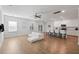 Open-concept living room features a kitchen with an island and modern white sofas at 1216 Ashley Hall Rd, Charleston, SC 29407