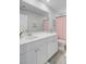 Well-lit bathroom with white cabinets, a large mirror, and a stylish shower curtain at 1226 Spotflower St, Summerville, SC 29485