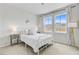 Bright bedroom with a white bed frame, soft lighting, and serene decor at 1226 Spotflower St, Summerville, SC 29485