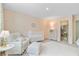 Bright Bedroom with soft pink walls, closet, a crib, and a comfortable chair with an ottoman at 1226 Spotflower St, Summerville, SC 29485