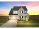 Inviting two-story home with a well-maintained lawn and attached two-car garage at 1226 Spotflower St, Summerville, SC 29485