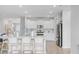 Bright kitchen featuring white cabinets, stainless steel appliances, and an island at 1226 Spotflower St, Summerville, SC 29485