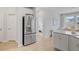 Bright kitchen featuring stainless steel appliances, white cabinets, and wood flooring at 1226 Spotflower St, Summerville, SC 29485