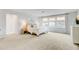 Spacious primary bedroom with a ceiling fan, natural light, and an ensuite bathroom at 1226 Spotflower St, Summerville, SC 29485