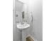 Clean powder room with a pedestal sink, a modern faucet, and updated finishes at 1226 Spotflower St, Summerville, SC 29485