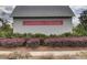 The Summers Corner welcome sign is surrounded by vibrant flowers and greenery at 1226 Spotflower St, Summerville, SC 29485