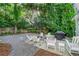 Outdoor space with fire pit, white seating, string lights, and a grill for perfect summer evenings at 1242 Schirmer St, Mount Pleasant, SC 29464